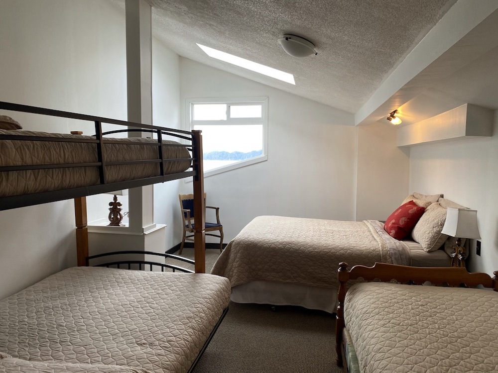 Bayview room with several beds, located in Big Fish Lodge, Port Renfrew, British Columbia